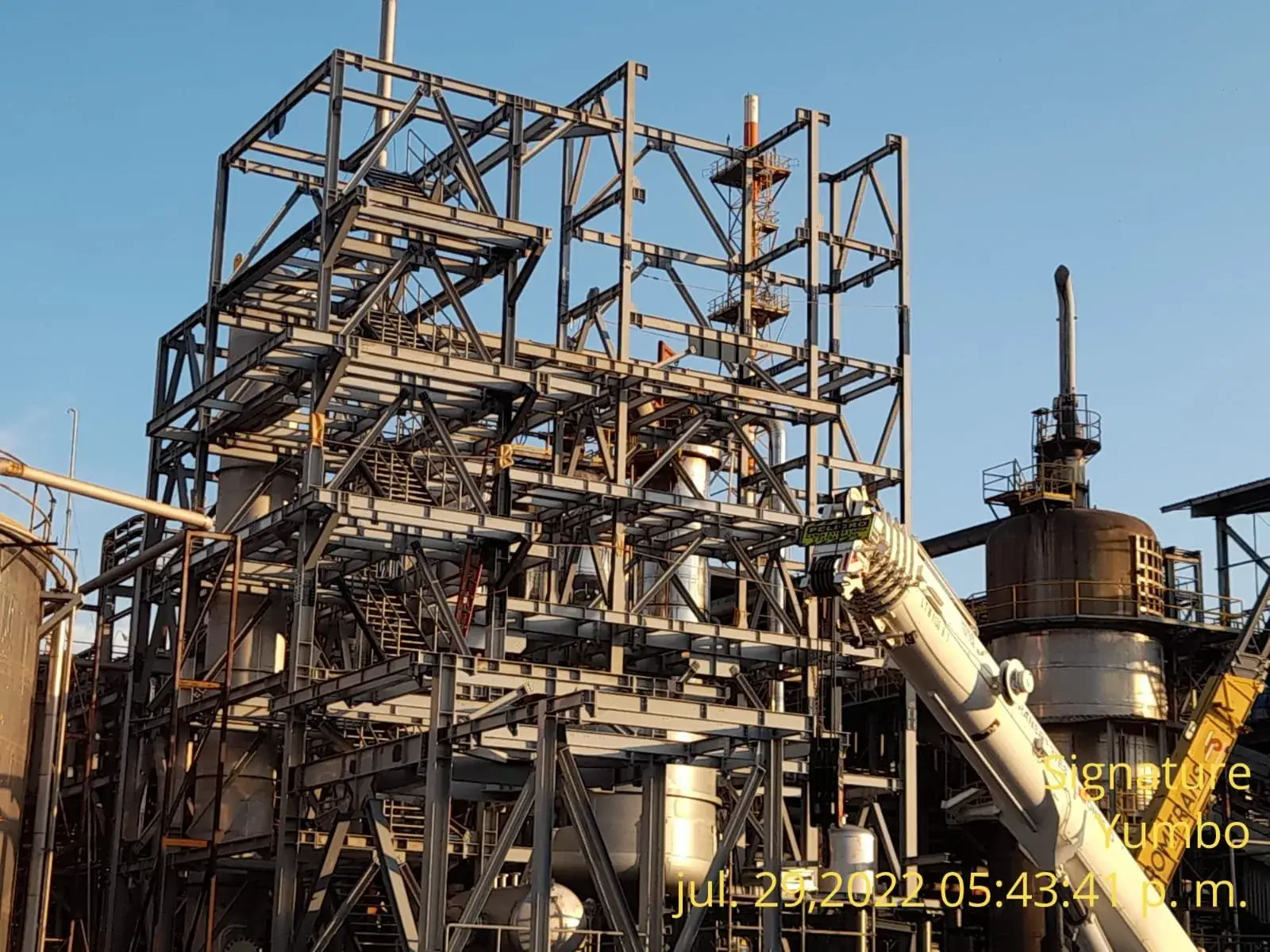 Photograph of the industrial steel structure during field installation and equipment coordination.